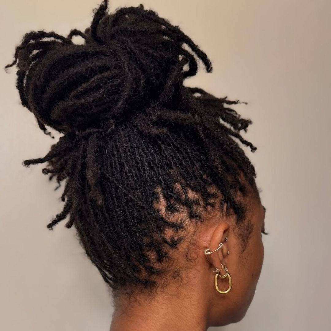woman with microlocs and high bun