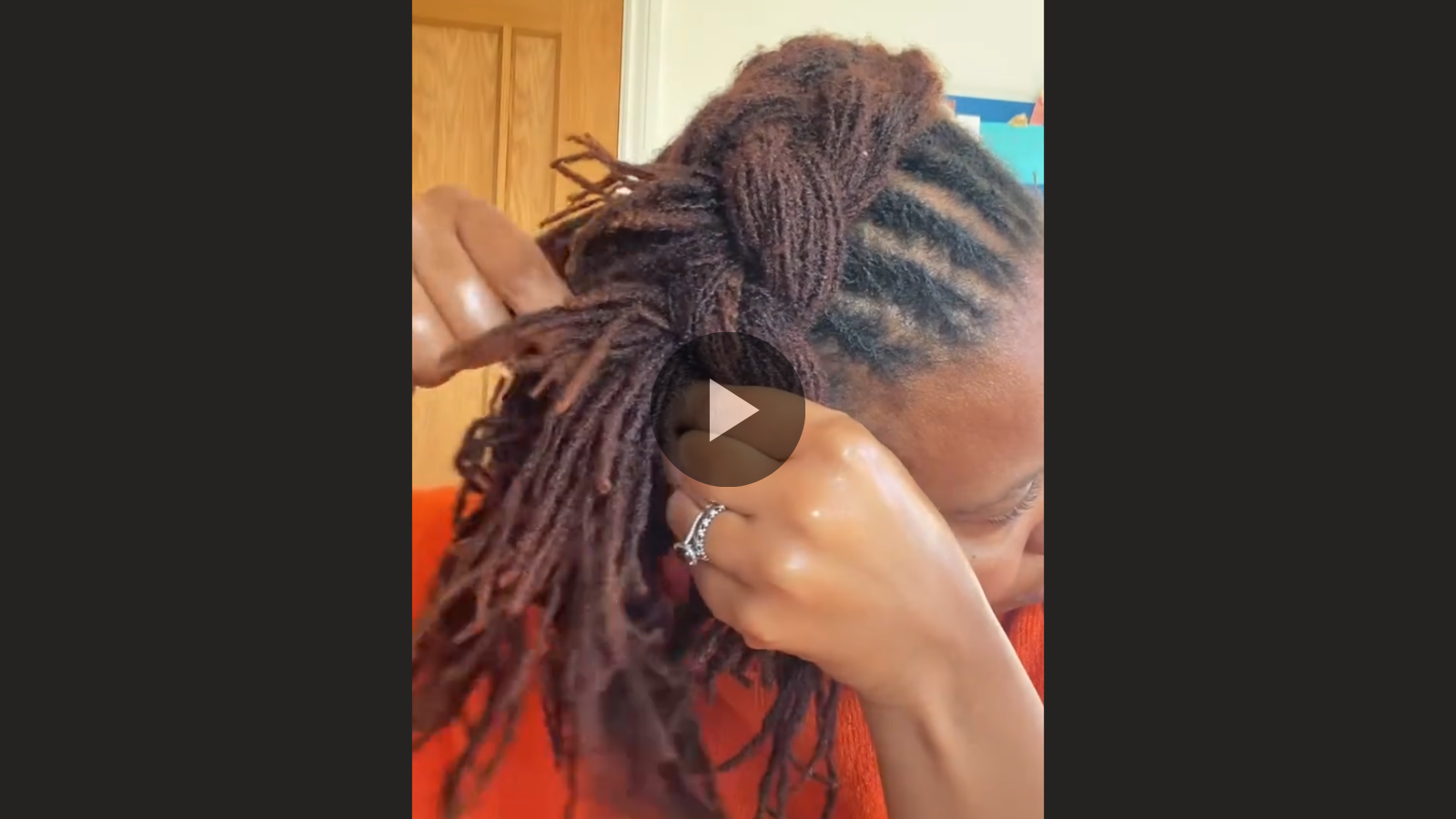 woman with microlocs and braided halo crown
