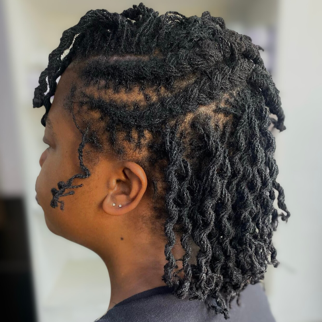 woman with microlocs and half up braids