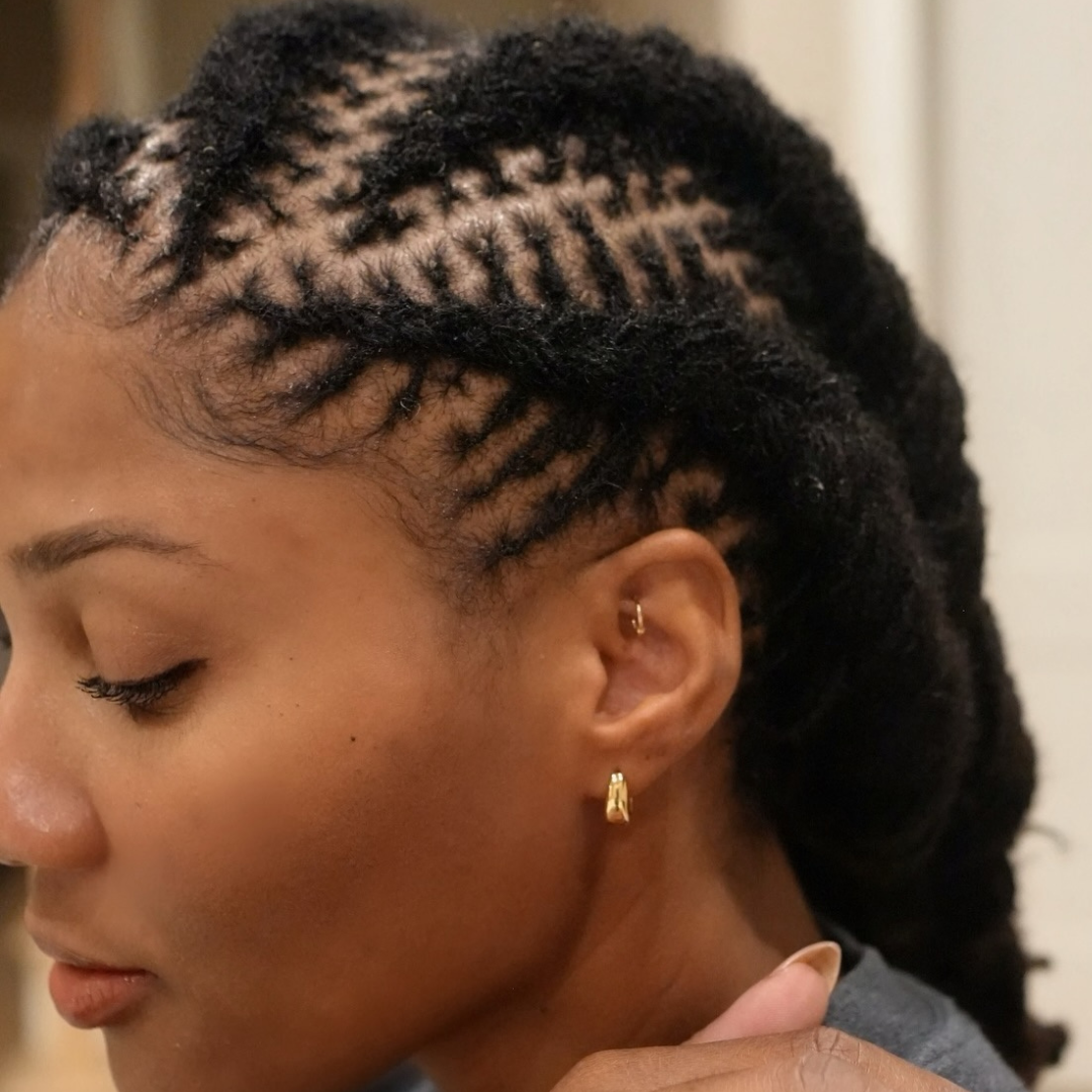 woman with microlocs cornrows