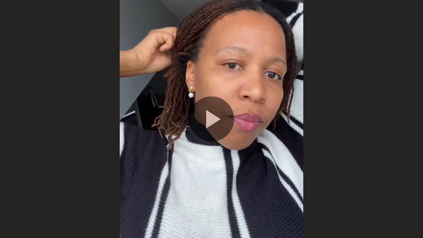 woman with microlocs and pin up updo