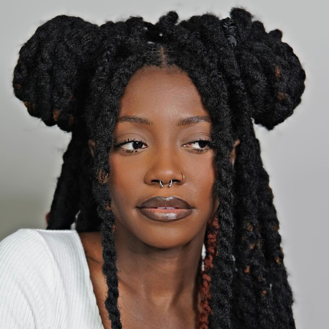 woman with microlocs and marley twist extensions