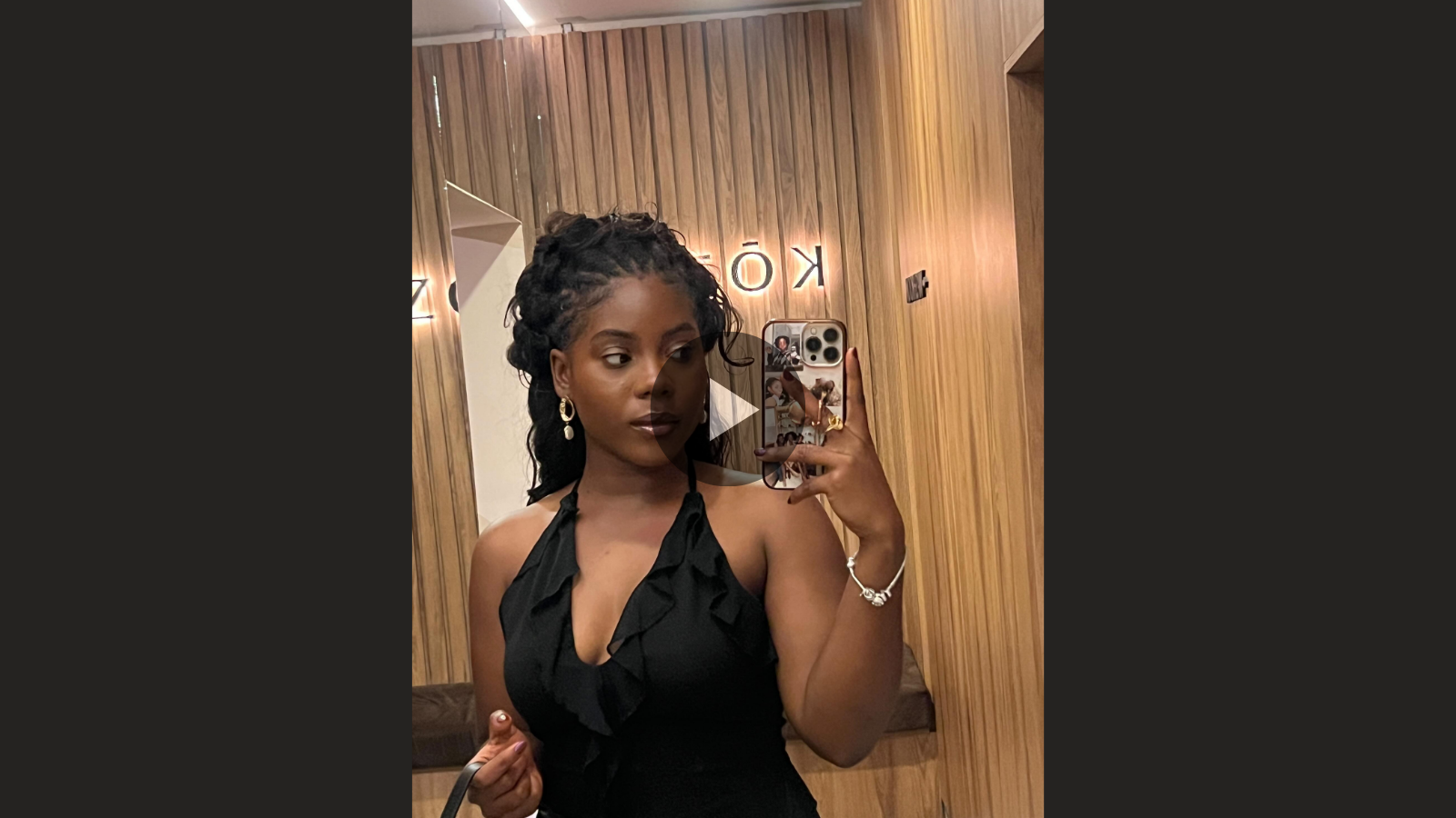 woman with microlocs half up half down hairstyle