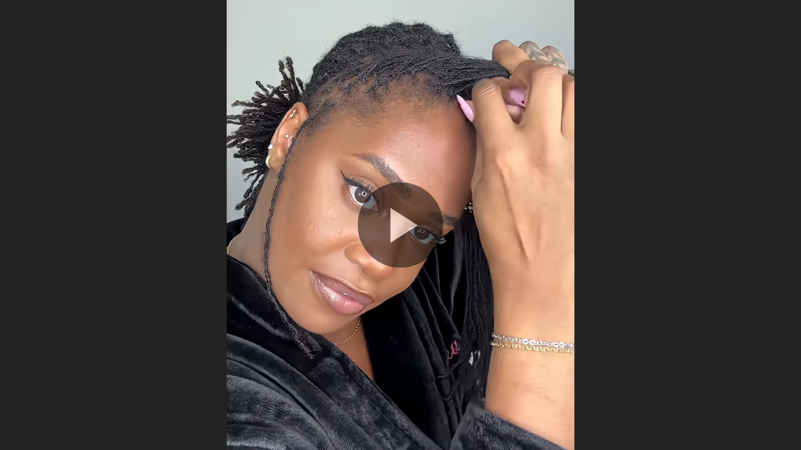 woman with microlocs and twisted crown bun updo