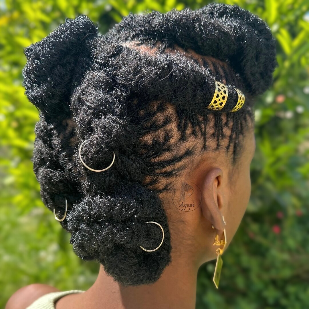 woman with microlocs and twisted embellished updo