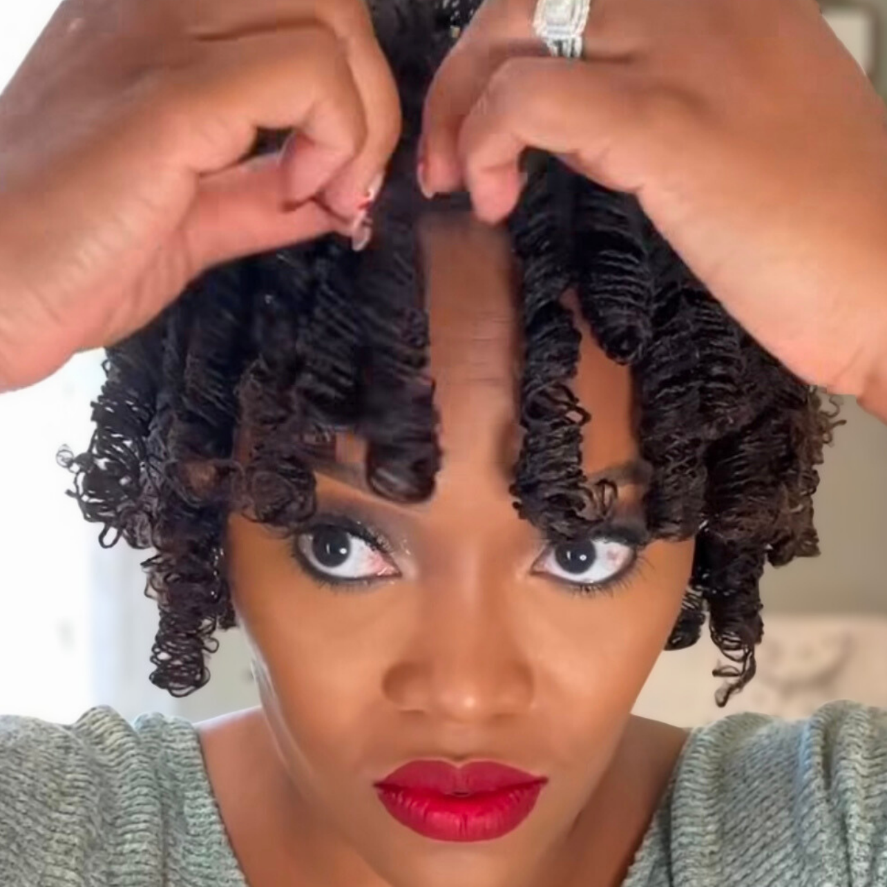 woman with microlocs and perm rod curls