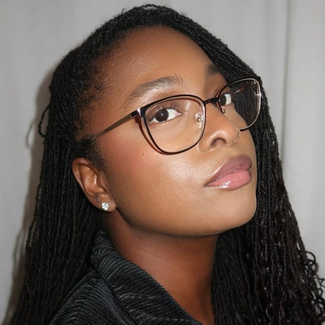 woman with microlocs  and braided extensions