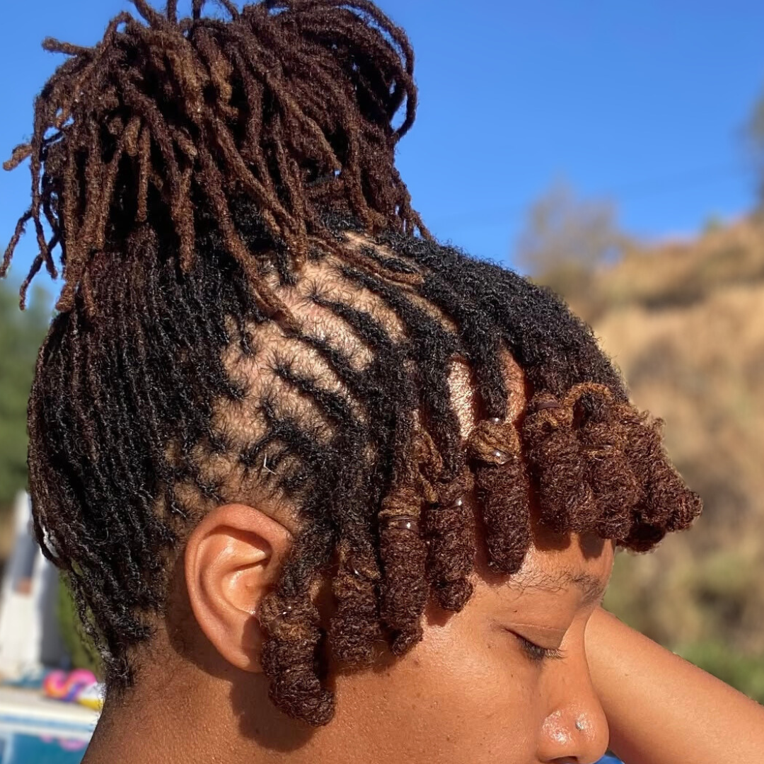 woman with microlocs and locknot bang and bun updo