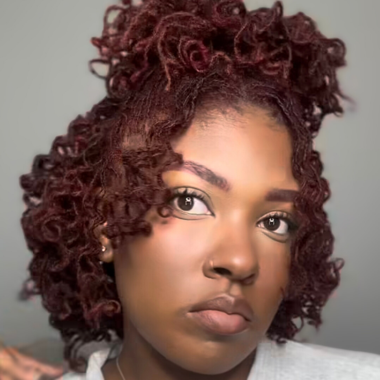 woman with microlocs and perm rod curls