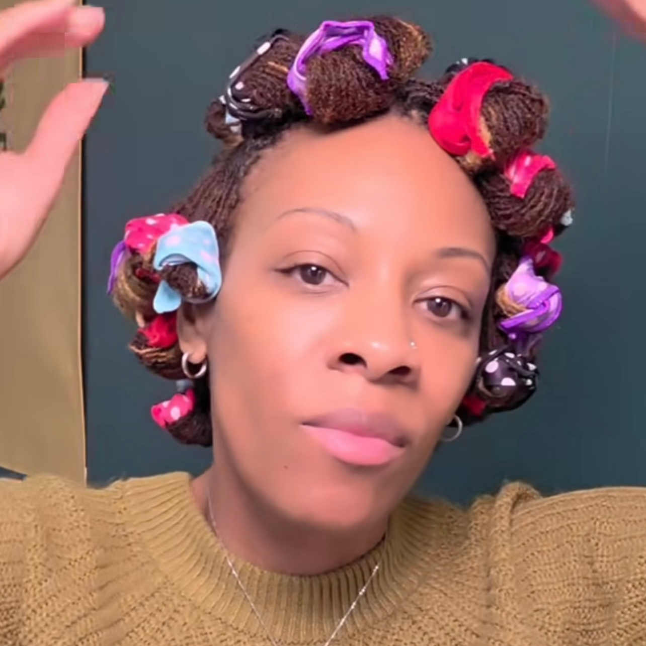 woman with microlocs and soft rollers