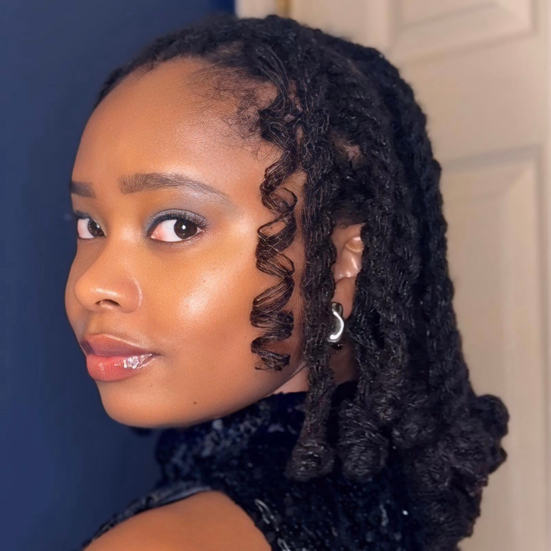 woman with microlocs and boho twists