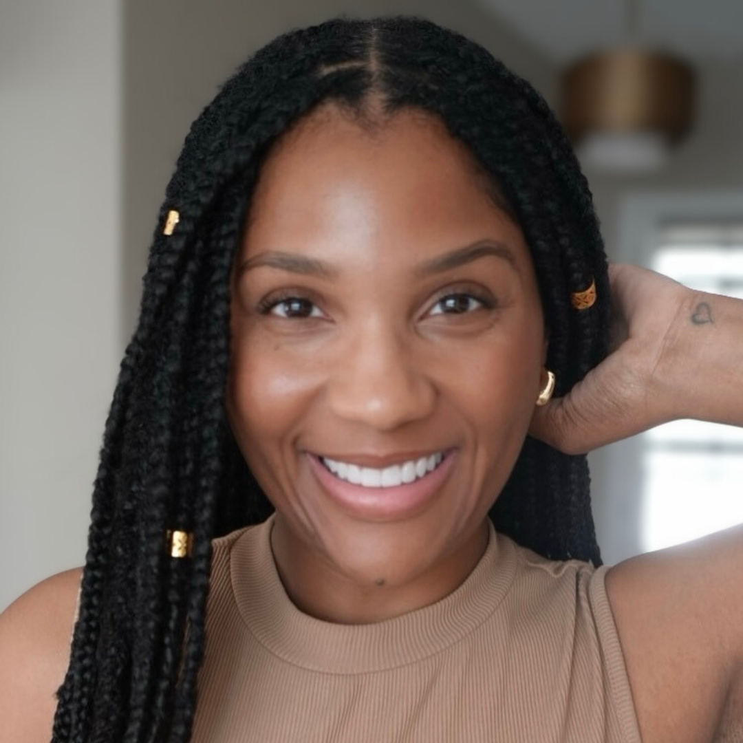woman with microlocs and boho braid extensions