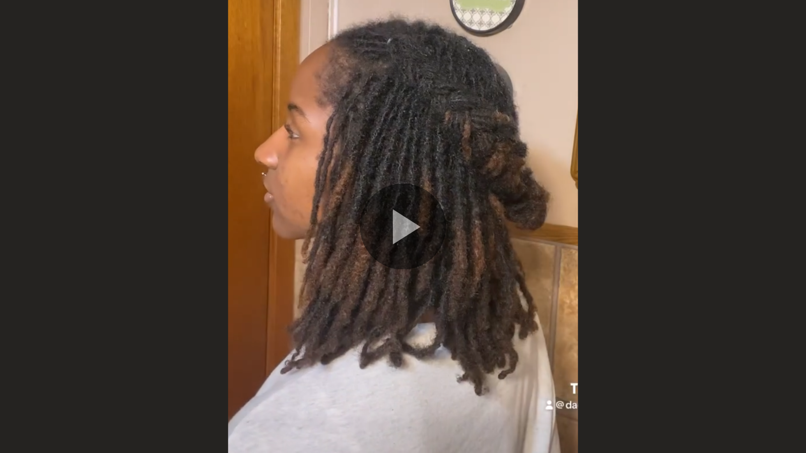 woman with microlocs and braided crown