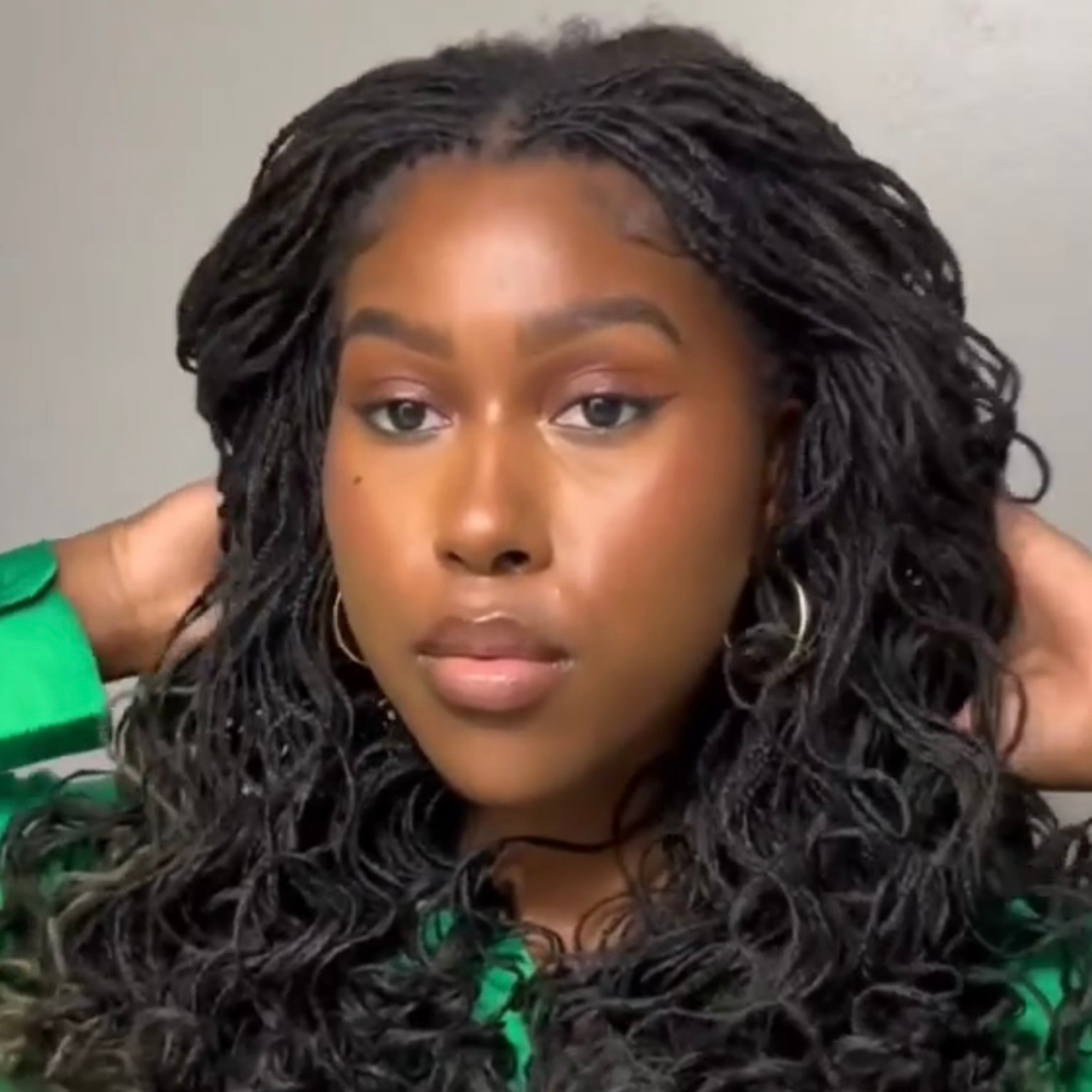 woman with microlocs and flexi rod curls