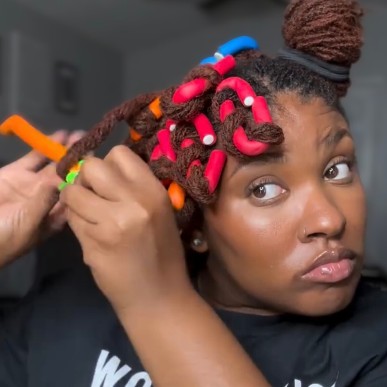 woman with microlocs and flexi rod curls