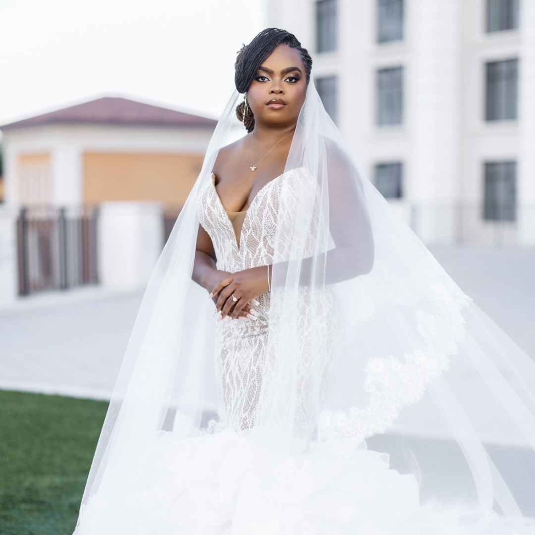 woman with microlocs bridal bun hairstyle for her wedding
