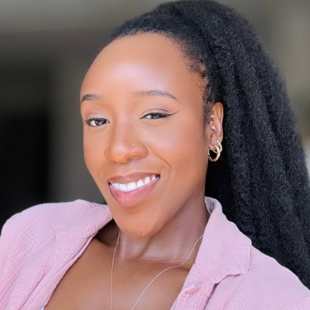 woman wiith microlocs and marley ponytail