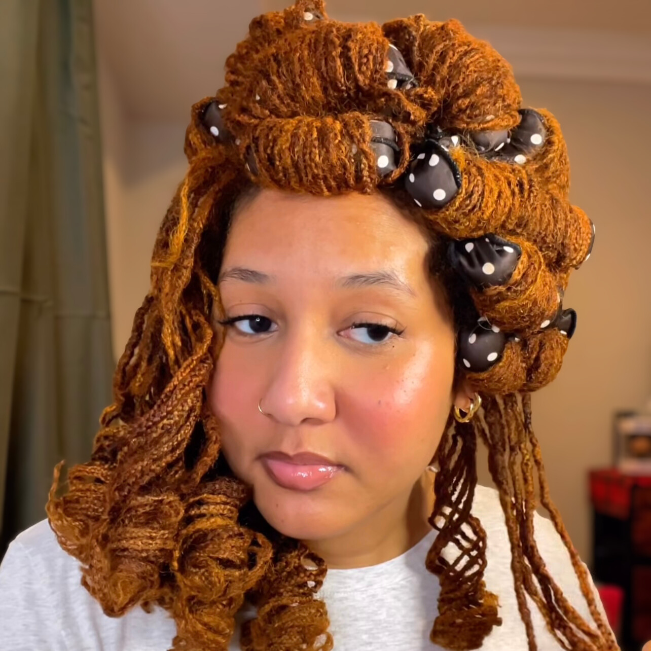 woman with microlocs and soft pillow roller curls