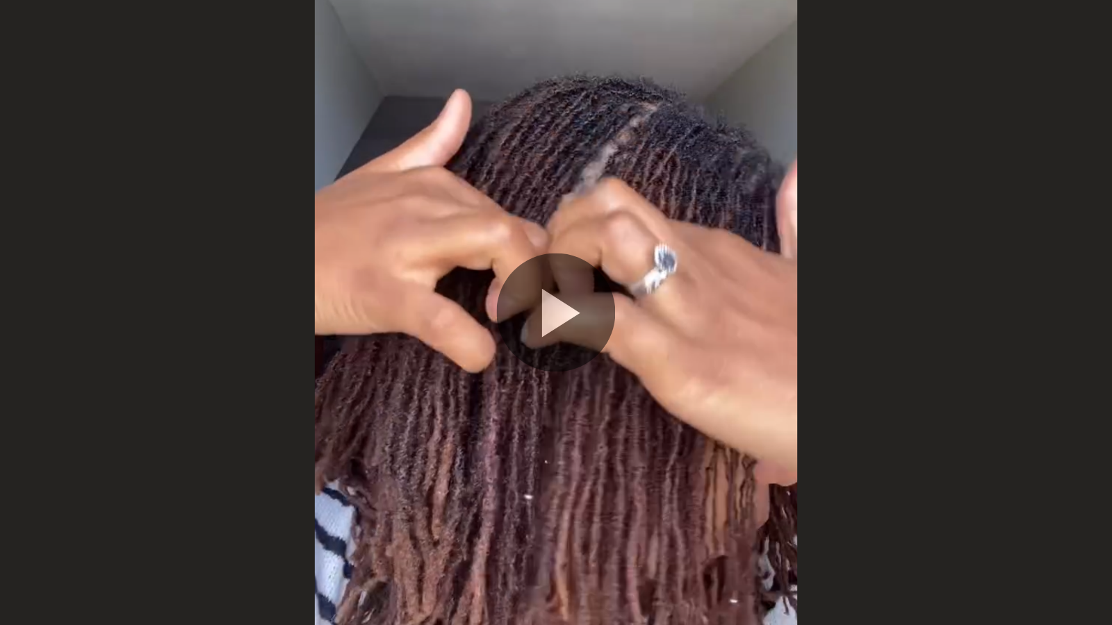 woman with microlocs and halo braids updo