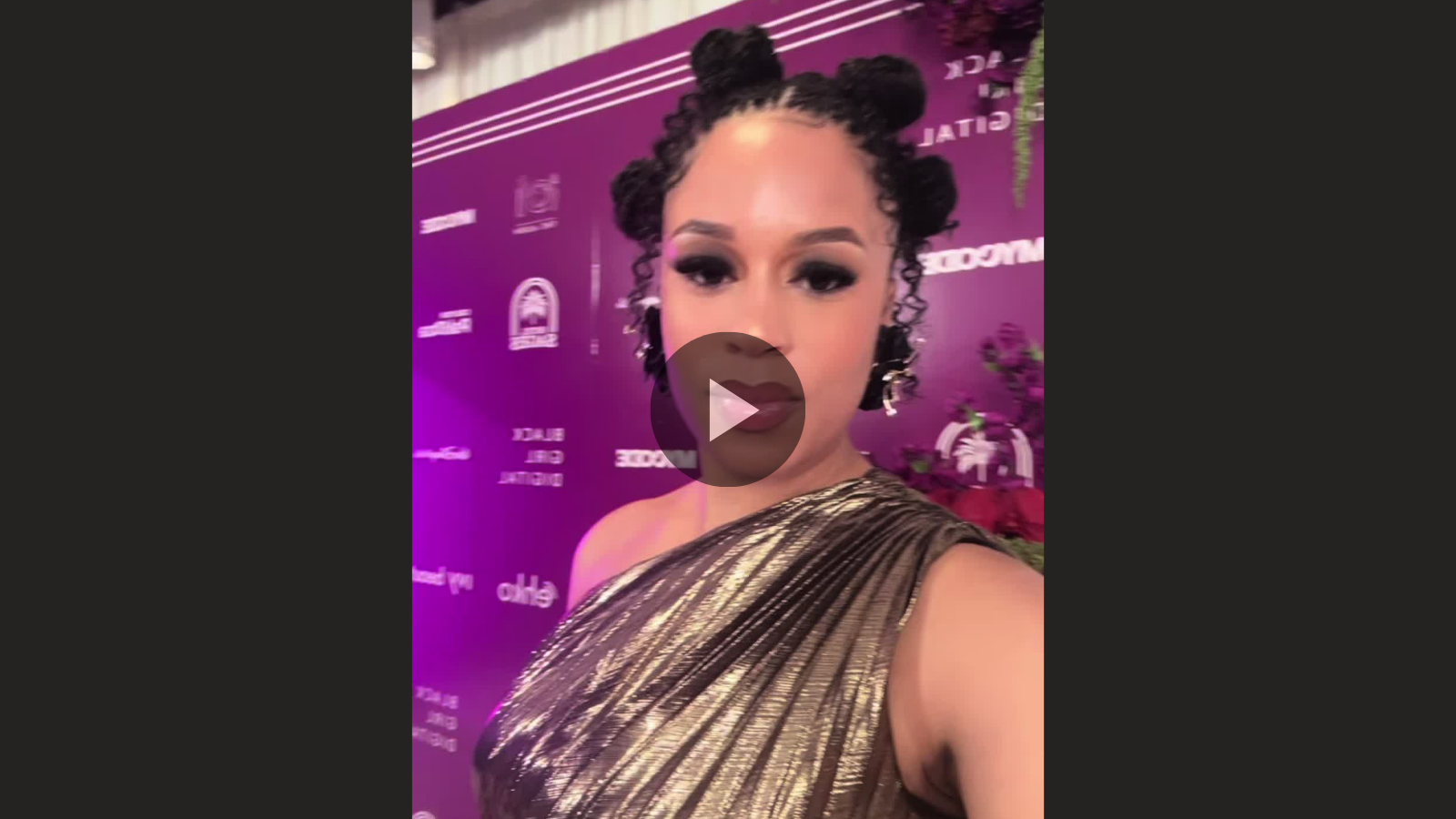 woman with microlocs bantu knot hairstyle