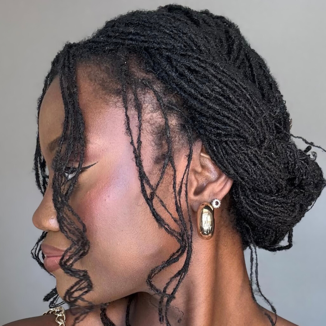 woman with microlocs and boho halo crown braids