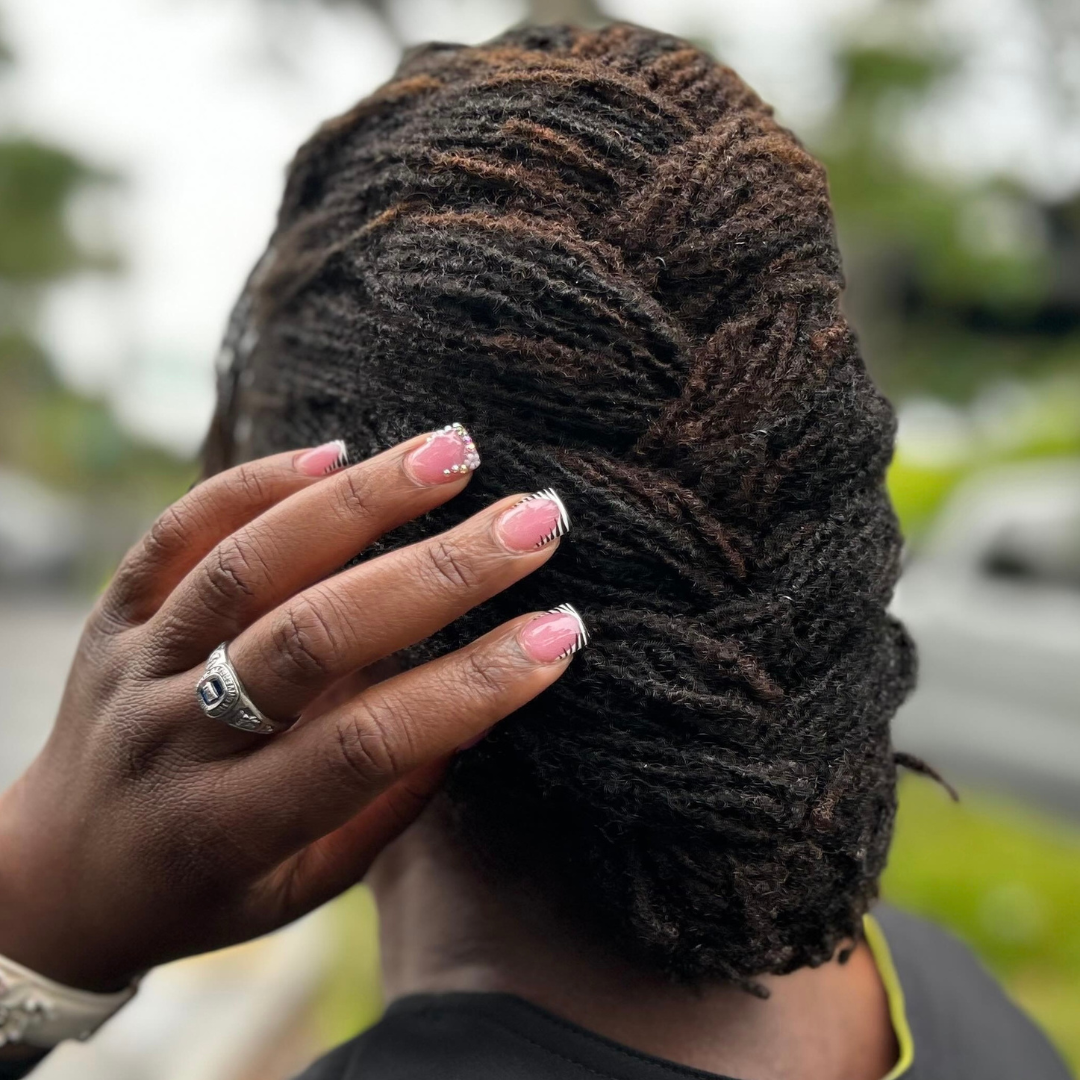 woman with microlocs and jumbo french roll