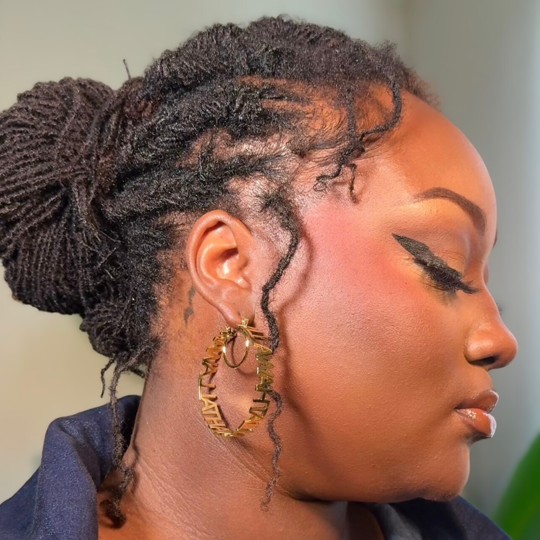 woman with microlocs and flat twist bun
