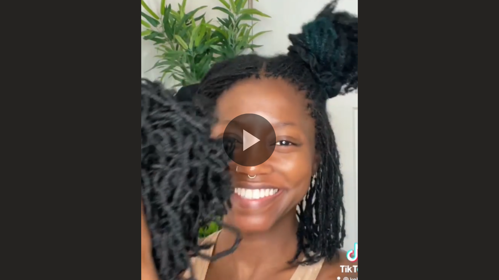 woman with microlocs and cornrow extensions