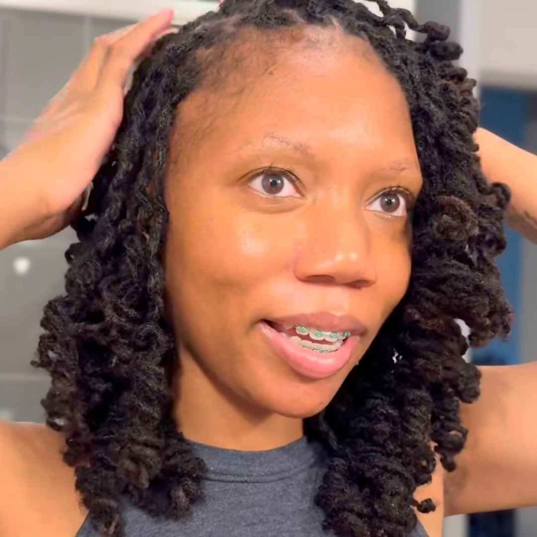woman with microlocs and barrel curls