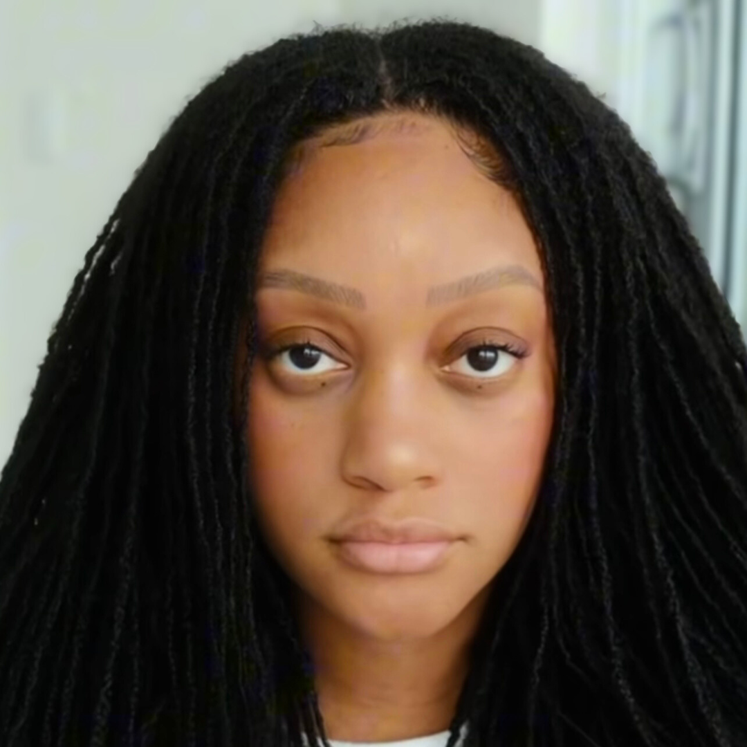 woman with microlocs and clip in extensions