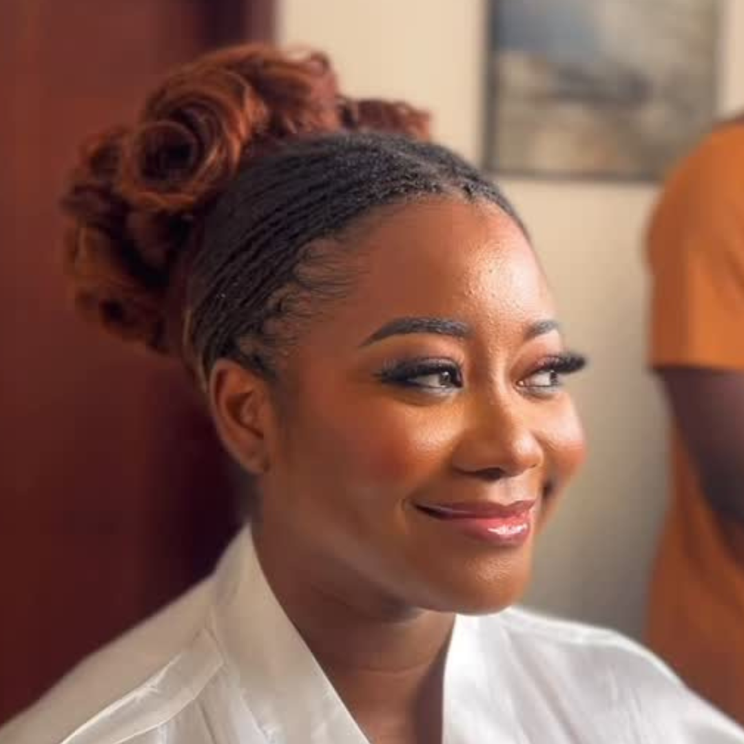 woman with high microlocs bun bridal hairstyle for her wedding