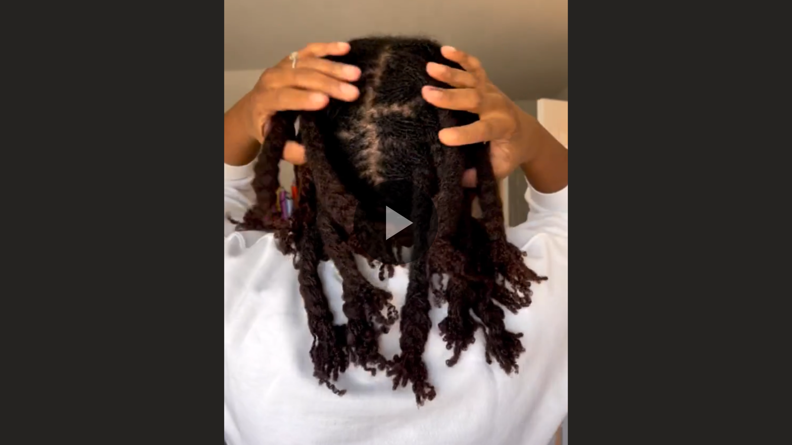 woman with microlocs and braidout curls