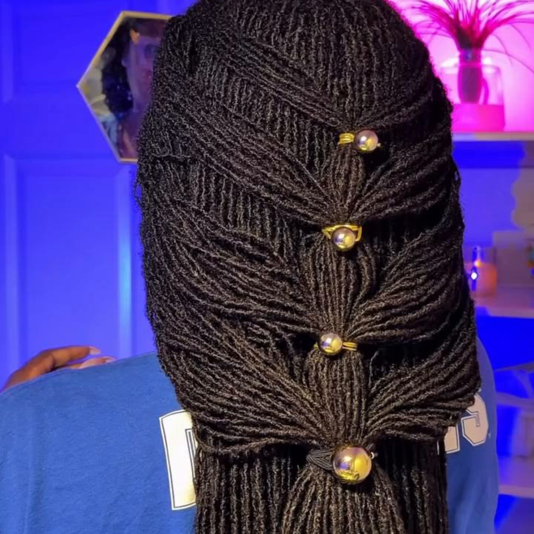 woman with tapestry hairstyle on long microlocs