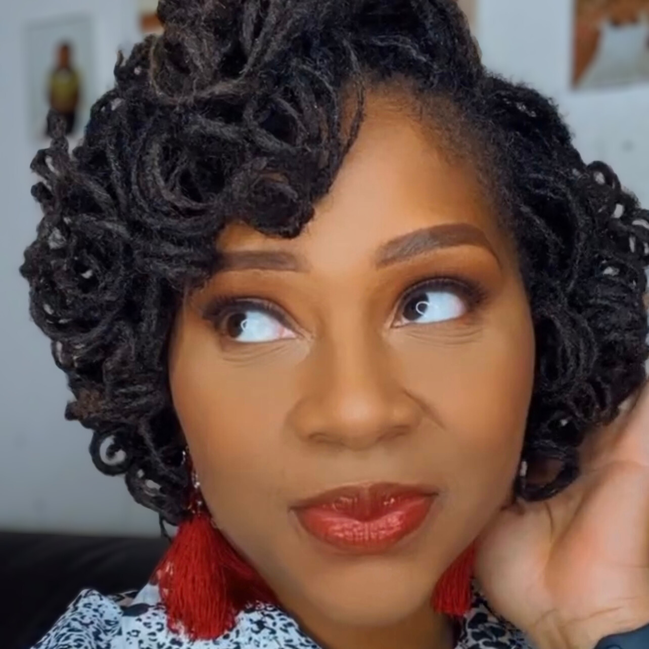 woman with microlocs and perm rod curls
