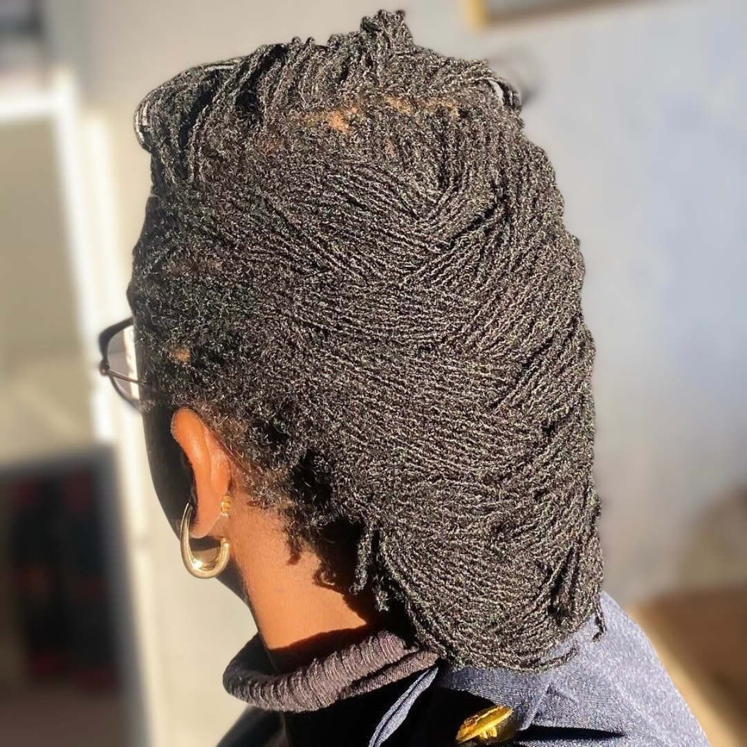 woman with microlocs and french braid