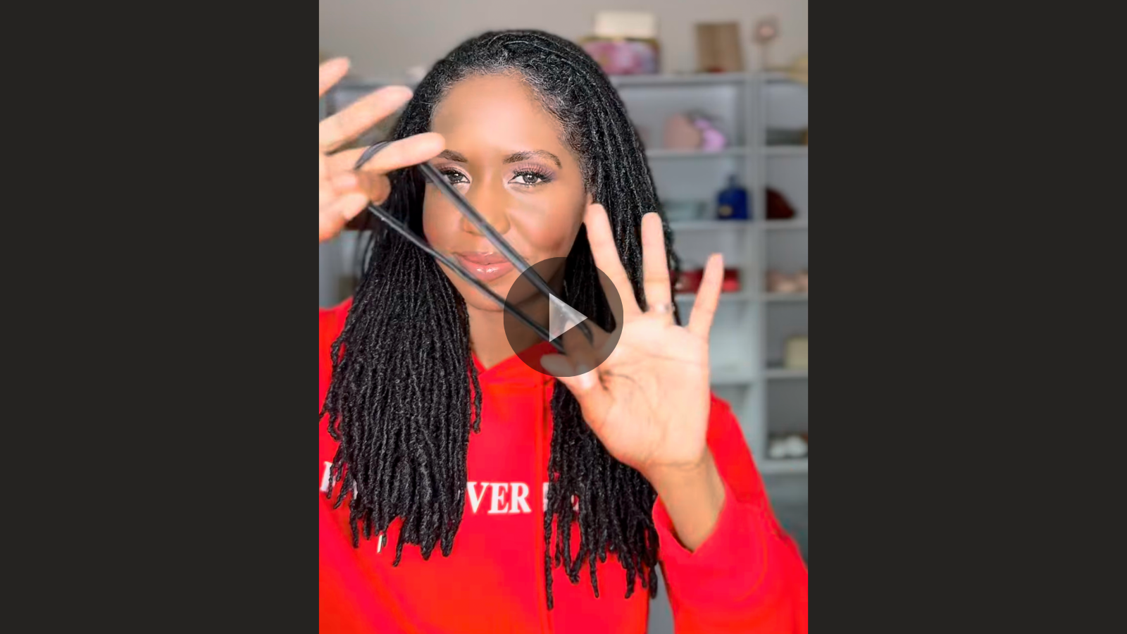 woman with microlocs and top bun