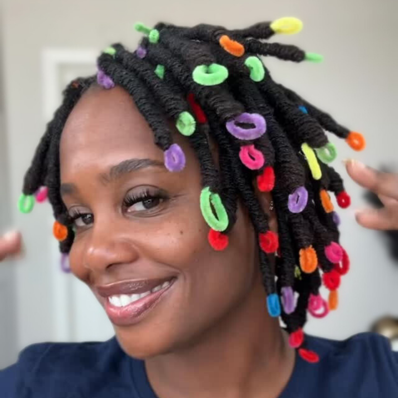 woman with microlcs and pipe cleaner curls