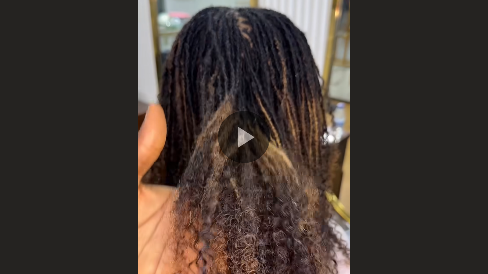 woman with microlocs and brazilian kinky curly extension
