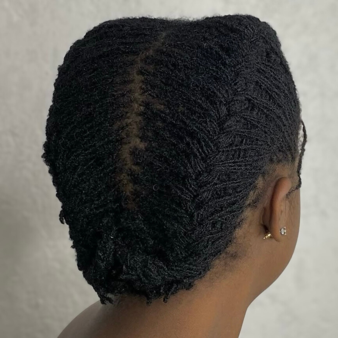 woman with microlocs and french braids updo