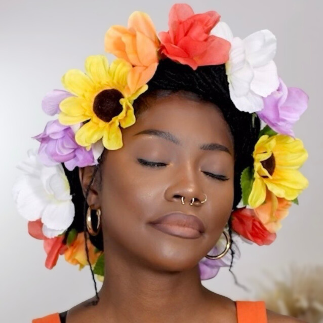 woman with microlocs and flower crown