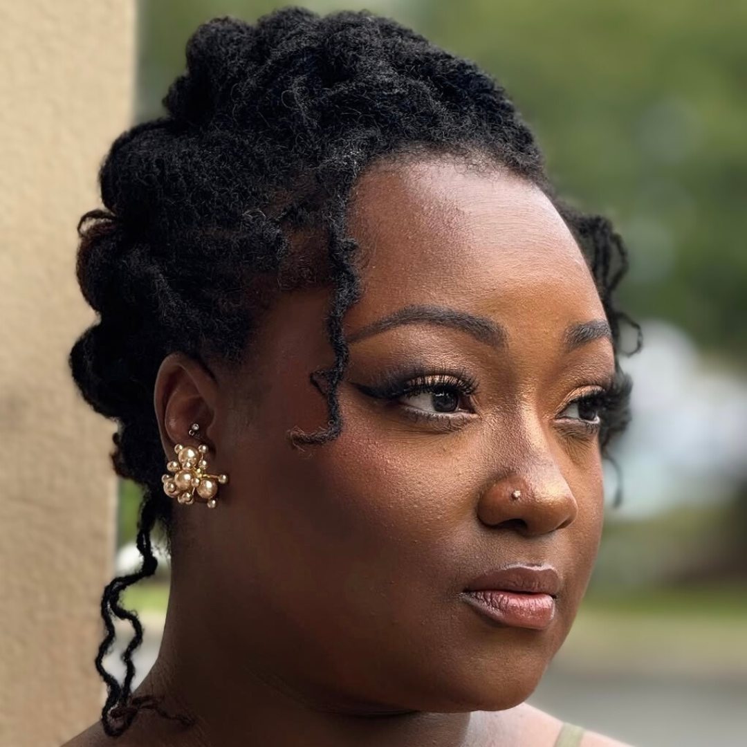 woman with microlocs and boho french rolls