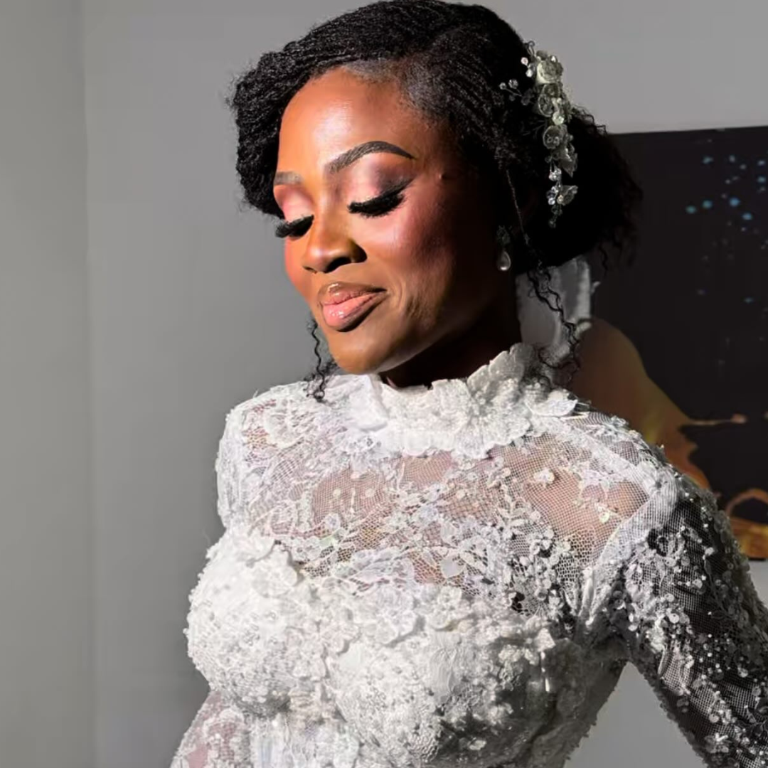 woman with bridal microlocs bun hairstyle for wedding day