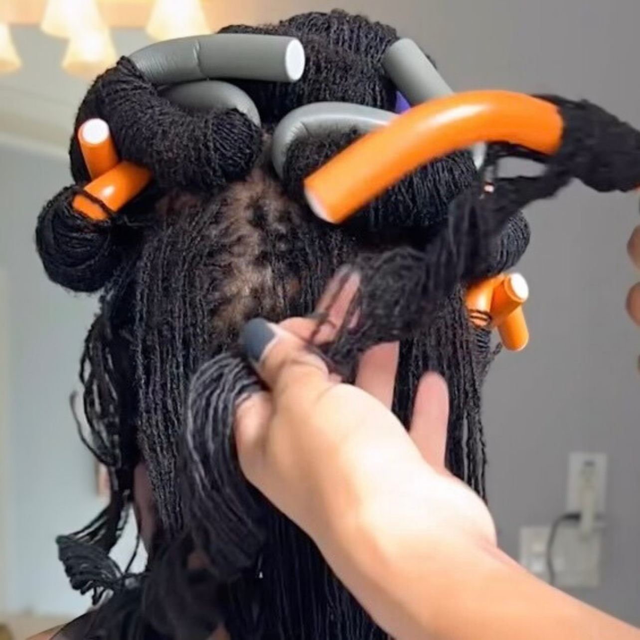woman with microlocs and flexi rods
