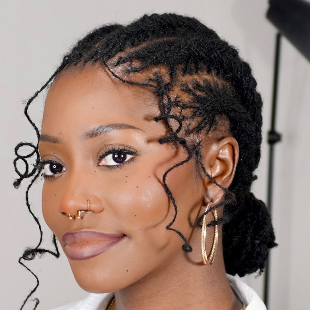 woman with microlocs cornrows