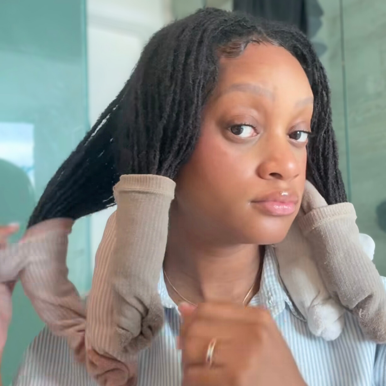 woman with microlocs and sock curls