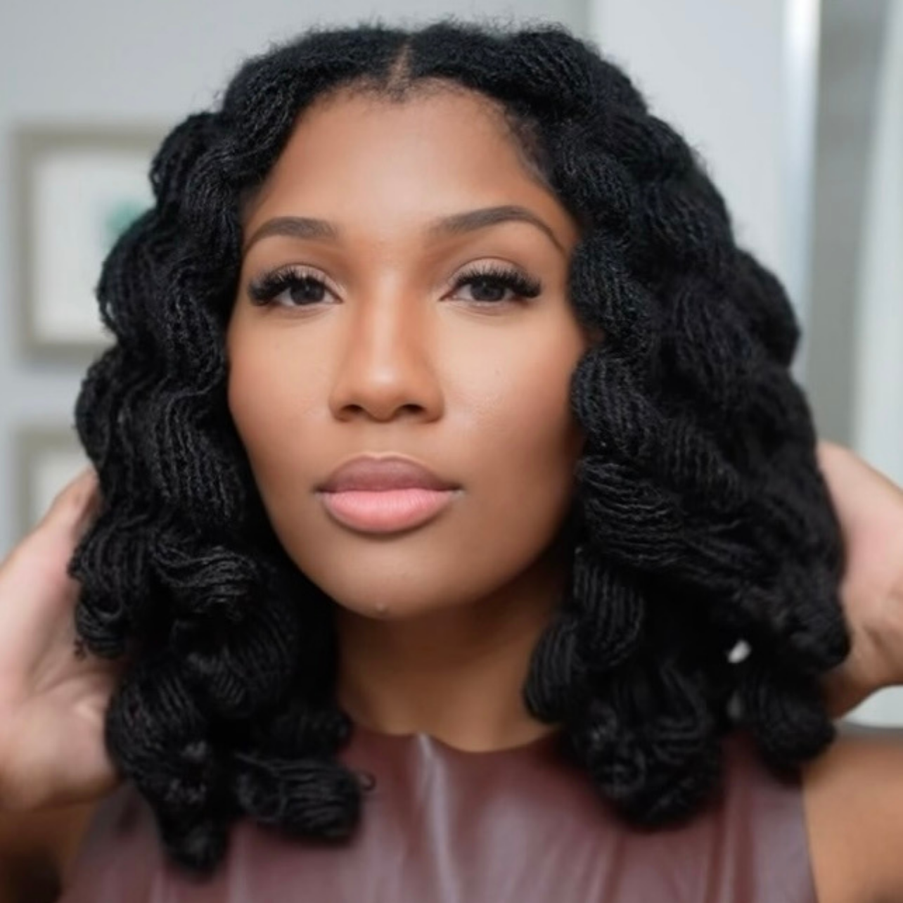 woman with microlocs and flexi rod curls