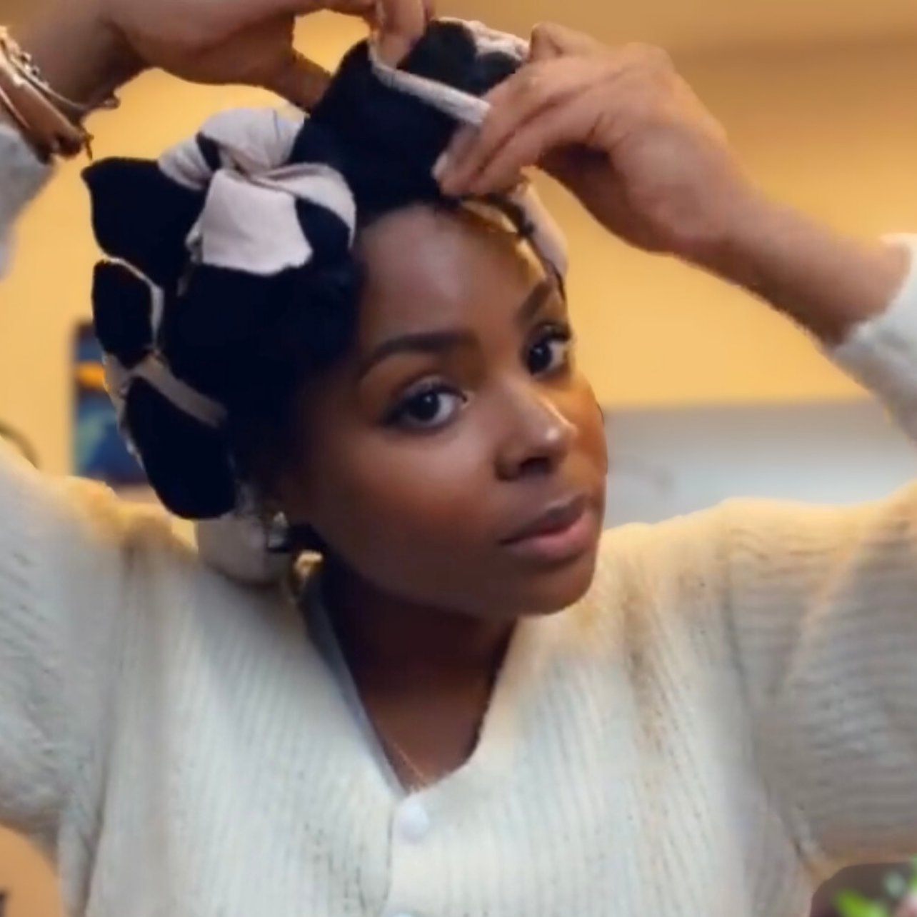 woman with microlocs and sock curls