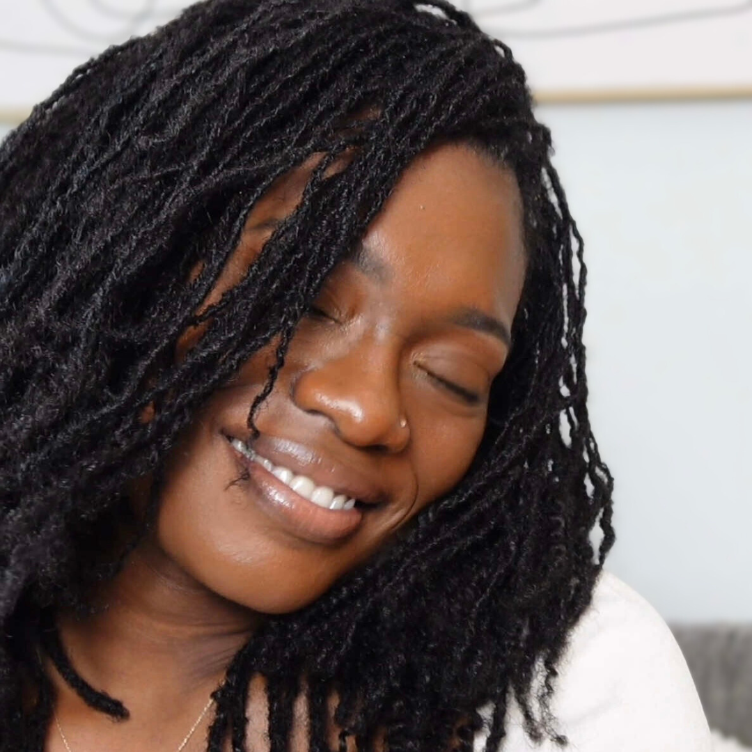 woman with microlocs and clip in extensions