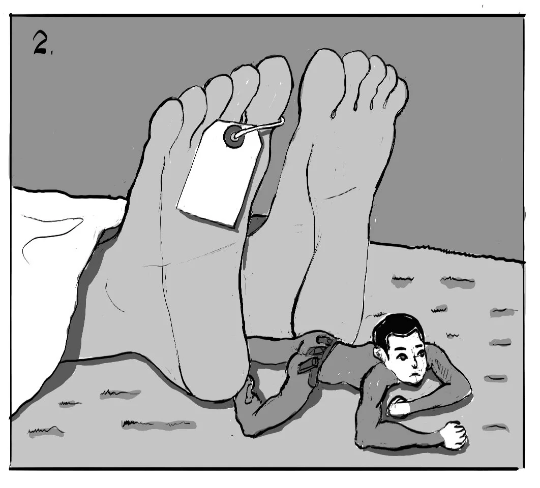 A person lying on the ground, supporting their head with one arm, next to large feet with a shoe and a tag.