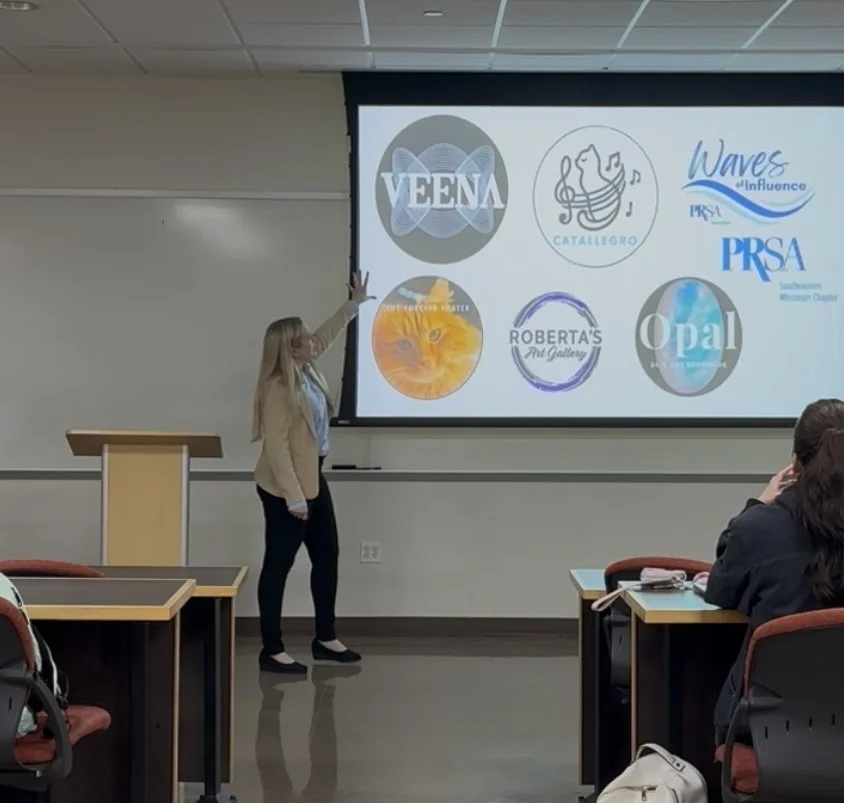 Veena Johnson presenting social media strategy projects to a university class
